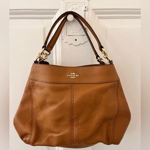 Beautiful Coach bag with adjustable shoulder/ crossbody strap! Gently used.